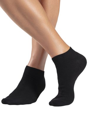 Schwarze Socke bis zum Knöchel aus einem glatten, dehnbaren Material, versehen mit einem gerippten Bund oben und einer nahtlosen Zehenpartie für zusätzlichen Komfort.