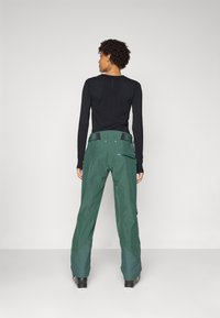 Norrøna LOFOTEN INSULATED PANTS - Lyžařské kalhoty - jungle green