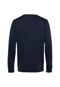 Felpa della marina con maniche lunghe, collo rotondo e polsini e orlo a coste. Tessuto liscio, progettato senza loghi visibili o decorazioni.