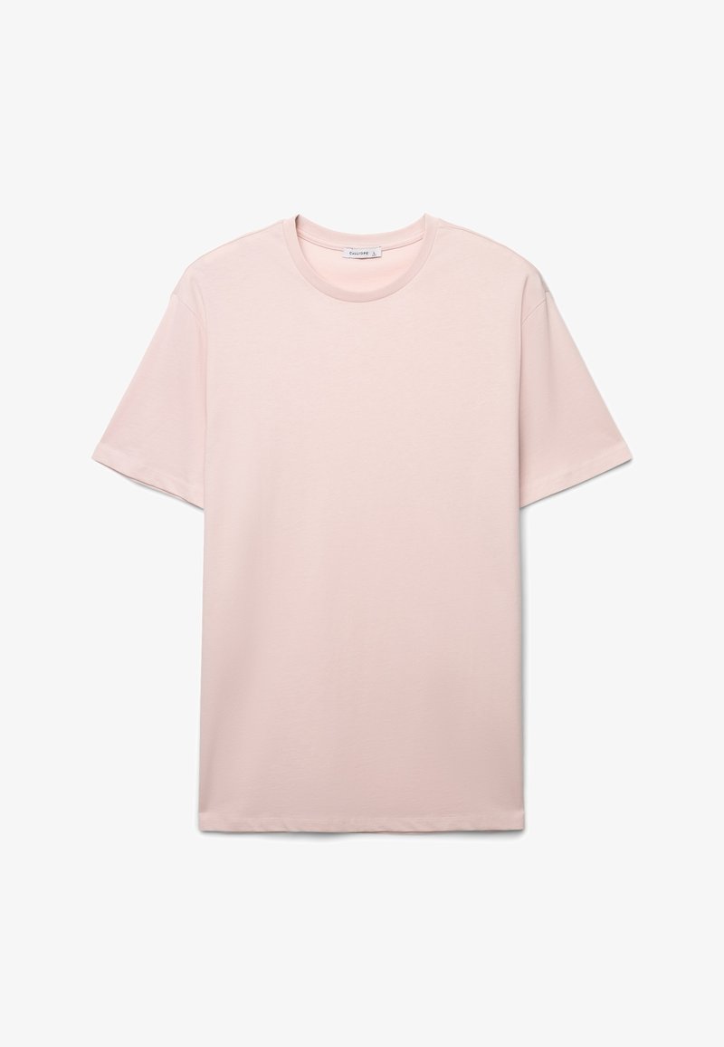 T-shirt in cotone rosa chiaro con maniche corte, scollo tondo e texture liscia. Design semplice, senza motivi o grafiche.