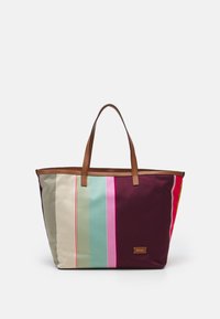 Large tote bag in various colored stripes including beige, teal, and maroon. Features brown leather handles and a metal logo plate.