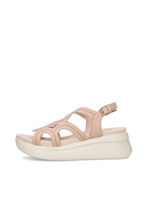 Sandalo in pelle beige con cinturino regolabile con fibbia, punta aperta e suola platform spessa bianca imbottita.