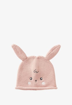 Bonnet tricoté rose avec des oreilles de lapin, visage rond, yeux brodés et joues roses. Texture douce et finition avec un bord côtelé.