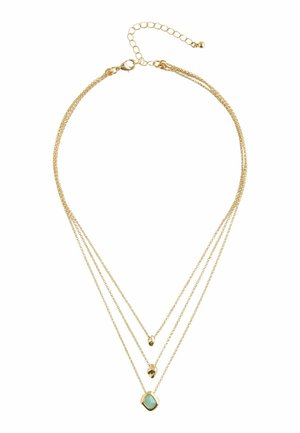 Gold multi-layered necklace featuring three chains of varying lengths, with a decorative turquoise pendant and clasp closure.