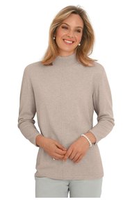 Hellbeige Pullover mit Stehkragen, Dreiviertelärmeln und glatter Textur. Mit einer zentralen Nahtdetails und gerippten Bündchen.