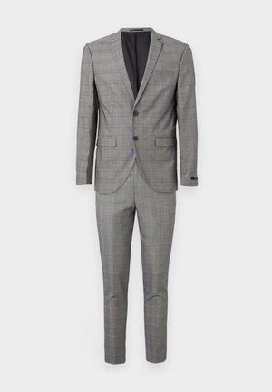 Completo a quadri grigio con giacca a due bottoni e pantaloni con tasca piatta. Realizzato in tessuto testurizzato, presenta una fodera nera e tasche laterali.