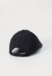 Black cap with a curved visor, made of lightweight fabric. Features ventilation holes and an adjustable strap at the back, smooth texture.