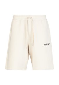 Lichtbeige katoenen shorts met een elastische tailleband en trekkoord. Kenmerkt zich door een zwart "REPLAY" logo aan de linkerkant.