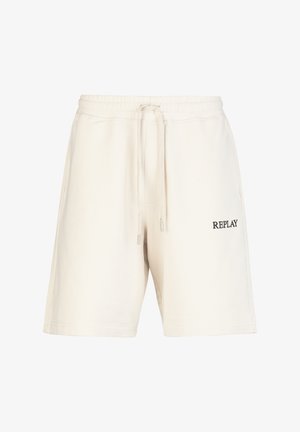 Lichtbeige katoenen shorts met een elastische tailleband en trekkoord. Kenmerkt zich door een zwart "REPLAY" logo aan de linkerkant.