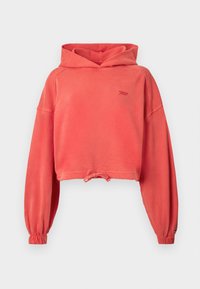 Koraliowy krótki hoodie wykonany z miękkiej bawełny. Posiada ściągacz przy dolnym brzegu, długie rękawy z elastycznymi mankietami oraz subtelne logo na klatce piersiowej.