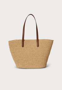Torbica od tkanog slame s smeđim kožnim ručkama, široke otvorene strukture i prirodne bež boje s teksturiranim detaljima.