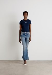 Tommy Jeans CLEO - Bootcut jeans - denim dark