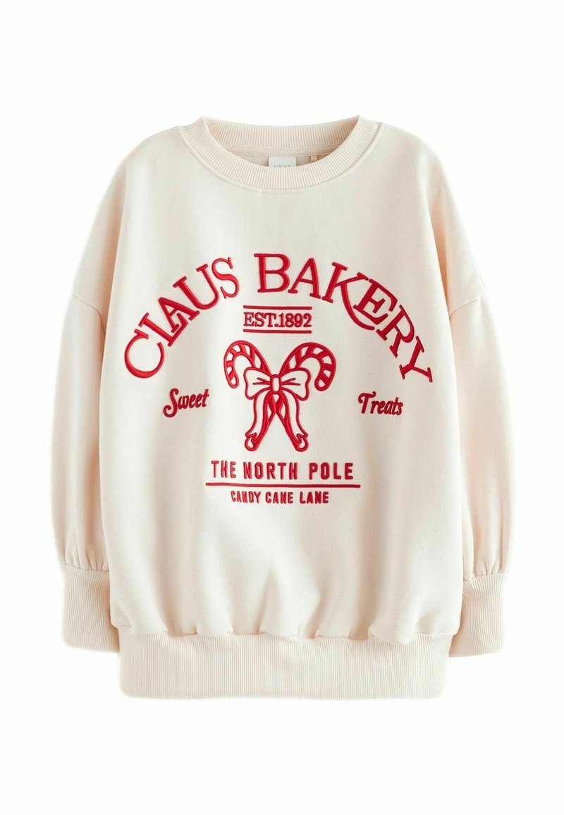 Cremefarvet sweatshirt med rødt grafiktryk, der viser "CLAUS BAKERY" og slikkepind-detaljer. Har ribbede manchetter og rund halsudskæring.