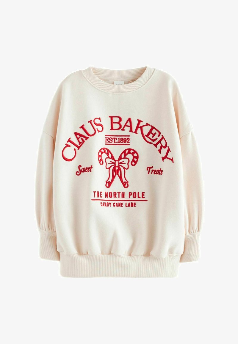 Cremefarvet sweatshirt med rødt grafiktryk, der viser "CLAUS BAKERY" og slikkepind-detaljer. Har ribbede manchetter og rund halsudskæring.