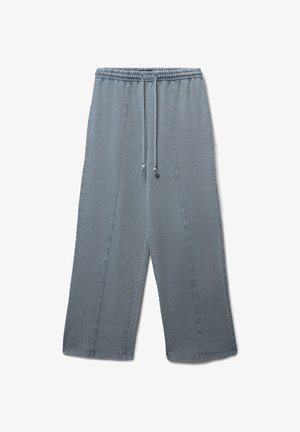 Light grey, wide-leg pants with an elastic waistband, drawstring closure, and side seam stitching details. Smooth, cotton blend fabric.