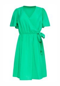 Groene wikkeljurk met korte pofmouwen, V-hals, gegatherde taille en een strikaccent. Gemaakt van lichte, iets gestructureerde stof.