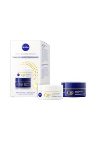 NIVEA Q10 Anti-Wrinkle Power skincare set includes a white day cream and a blue night cream, both featuring labels with gold accents.