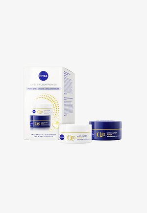 NIVEA Q10 Anti-Wrinkle Power skincare set includes a white day cream and a blue night cream, both featuring labels with gold accents.