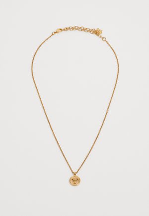 Gold-tone necklace with a fine chain and circular pendant featuring a textured lion motif. Adjustable clasp for sizing versatility.