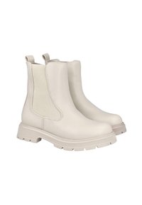 Botas Chelsea de color crema que presentan un suave cuero sintético, paneles laterales elásticos y una suela texturizada gruesa. Diseño minimalista con lengüetas para facilitar el calzado.