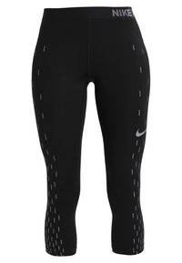 Leggings neri 3/4 con una texture liscia, logo Nike sulla banda in vita e strisce rosa verticali lungo i lati.