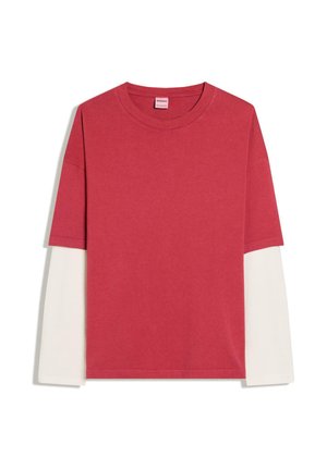 Red short-sleeve shirt layered over long white sleeves, crew neck, flat lay on white background.
