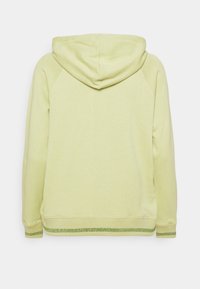Kapsáčová mikina ve světle zeleném textilu s texturovaným povrchem. Obsahuje žebrované manžety a lem s jemným zeleným detaily.
