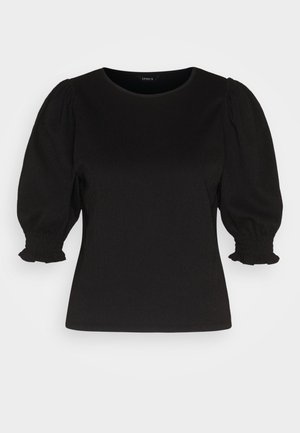 Black top with a rounded neckline and short puffed sleeves. Textured fabric with smocked detailing at sleeve hems.