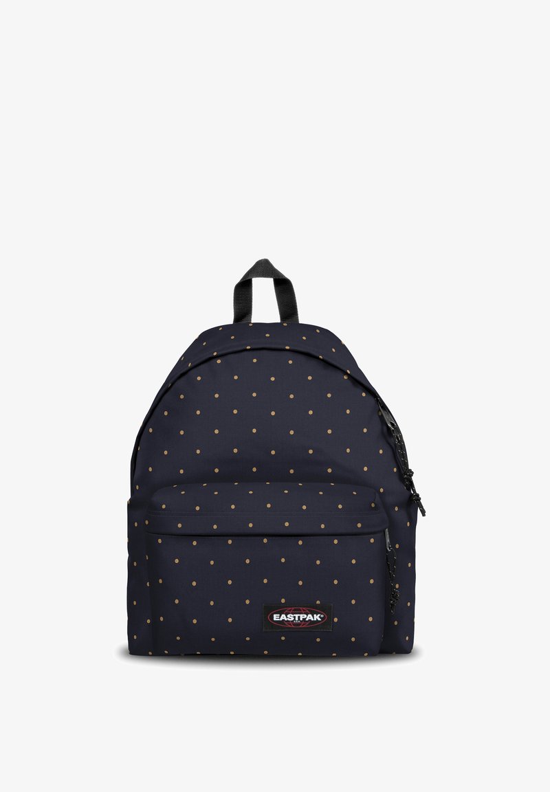 Sac à dos en tissu bleu marine avec pois dorés, bretelles réglables, poignée supérieure et poche frontale zippée. Étiquette de marque visible à l'avant.