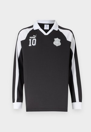 Crna sportska majica dugih rukava s bijelim ovratnikom, bijelim prugama na rukavima, logom Pume, brojem 10 i amblemom kelta čvor na prsima.