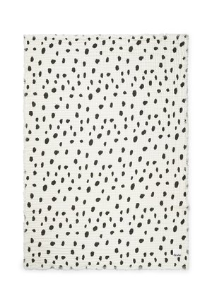 Hvidt rektangulært stof med ujævne sorte pletter spredt jævnt over hele overfladen.
