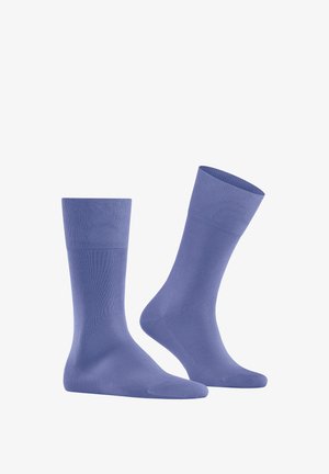 Calze di cotone viola con polsini a coste, lunghezza alla caviglia. Texture liscia, design senza cuciture alla punta, adatte per un uso quotidiano.