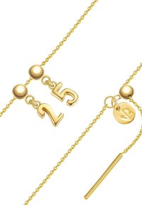 Gold chain earrings featuring a two-number design (25), spherical accents, and a circular charm with a leaf symbol, smooth texture.
