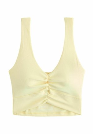 Lysegul cropped tanktop med brede stropper og rynket detalje foran i midten.