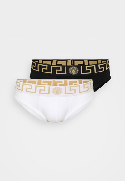 Caleçons noir et blanc avec un motif clé grec doré sur les ceintures, avec un accent logo au centre de chaque bande.