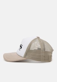 Trucker cap with a white front, beige brim, and tan mesh back. Features embroidered text on the front panel and a round top button.