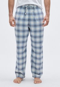 Pantaloni de pijama în carouri în tonuri de albastru deschis și alb. Realizați dintr-un material moale, cu talie elastică și șnur. Design cu croială dreaptă a piciorului.