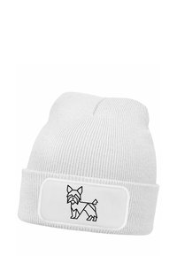White knitted beanie featuring a fold-up cuff with a rectangular patch displaying a black line drawing of a dog. Textured fabric for warmth.