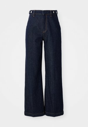 Mørkeblå vide jeans lavet af denim, med høj talje, fem-pocket design og kontrasterende orange syninger.