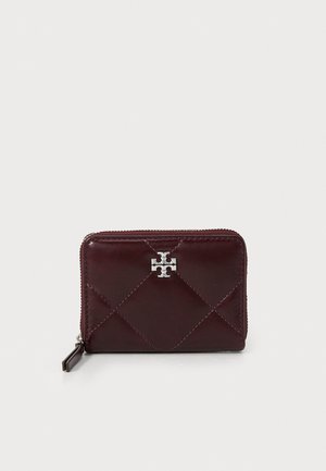 Burgundy leather wallet with quilted pattern, silver-tone hardware, zip-around closure, and logo accent on the front. Rectangular shape.
