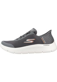 Grey mesh sneaker with a textured upper, white sole, and orange accents. Features a rounded toe and traditional lacing system.