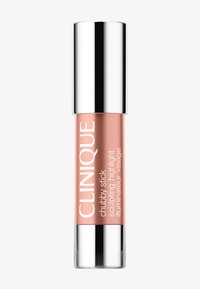 Maquillage illuminateur sculptant Clinique Chubby Stick en teinte pêche avec des bouchons argentés aux deux extrémités sur fond blanc.