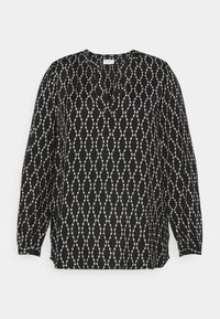 Schwarze Bluse mit V-Ausschnitt, langen Ärmeln und einem dekorativen weißen Punktmuster in wellenförmigem Design. Glatte Textur.
