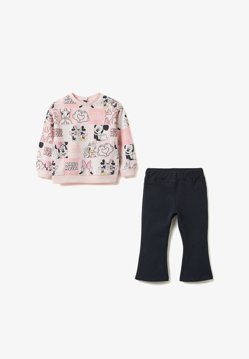 Rosa Sweatshirt mit Cartoon-Grafiken, gerippten Bündchen und Kragen. Schwarze Baumwoll-Leggings mit elastischem Bund und ausgestelltem Beinabschluss.