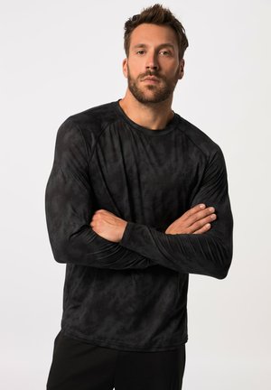 Zwarte lange mouwen sportshirt met een gemêleerd patroon. Heeft een ronde hals en raglanmouwen, ontworpen voor comfort en bewegingsvrijheid.