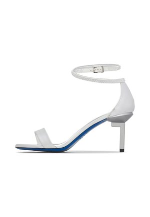 White high-heeled sandal with ankle strap, open toe, and blue sole, featuring a geometric square-shaped heel.