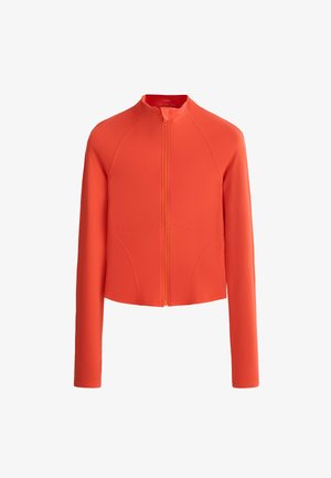 Veste longue à manches longues orange vif avec une fermeture éclair à l'avant et un col haut, présentant des détails de coutures simples à l'avant et sur les manches.