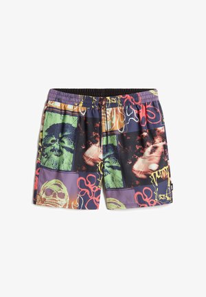 Swim shorts with a black elastic waistband, featuring a multicolored graphic print of skulls and abstract shapes against a dark background.
