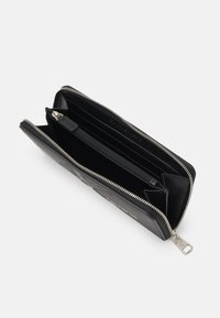 Calvin Klein Jeans SCULPTED ZIP AROUND MONO - Lommebok - black