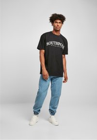 Southpole SPRAY  - Sirgete säärtega teksad - midblue washed